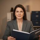 Legal practice administrator in a quiet office looking at an audit and access report